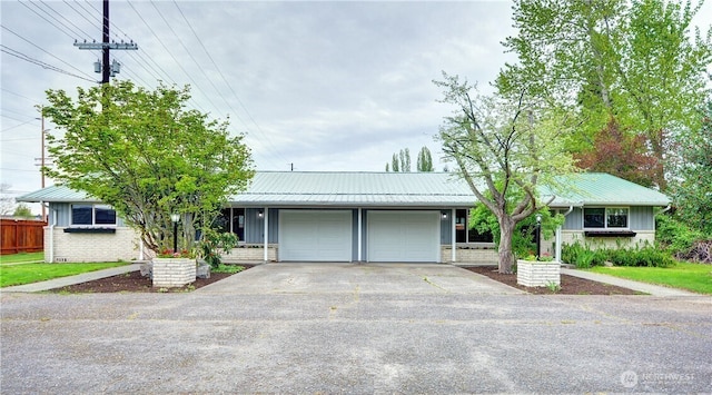 16327 Smokey Point Blvd Unit 1 & 2, Marysville, WA 98271 - ranch-style home featuring an attached garage, concrete driveway, board and batten siding, and metal roof