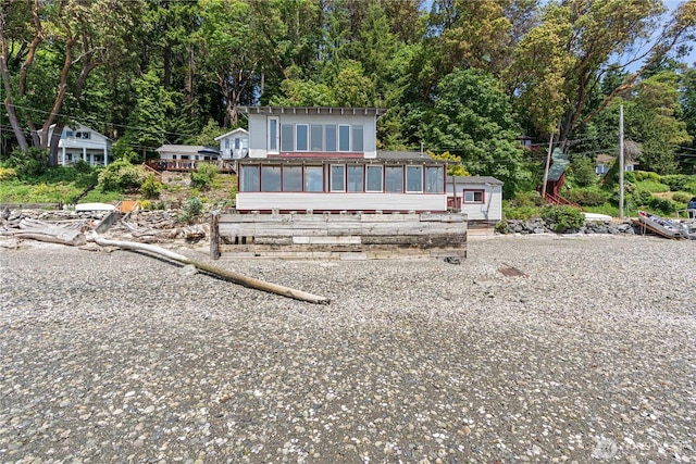 24186 Vashon Hwy SW, Vashon, WA 98070 - back of house with a sunroom and view of wooded area