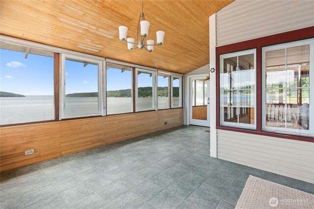 24186 Vashon Hwy SW, Vashon, WA 98070 - unfurnished sunroom featuring wooden ceiling, a water view, wood walls, lofted ceiling, and a chandelier