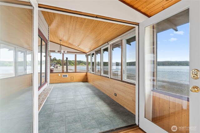 24186 Vashon Hwy SW, Vashon, WA 98070 - unfurnished sunroom with wooden ceiling, lofted ceiling, wood walls, and a water view