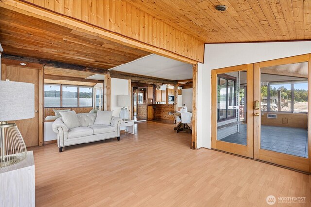 24186 Vashon Hwy SW, Vashon, WA 98070 - living room with wood finished floors, french doors, wooden ceiling, and vaulted ceiling