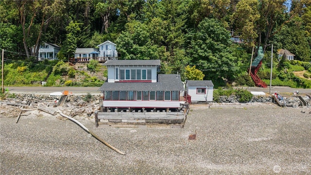 24186 Vashon Hwy SW, Vashon, WA 98070 - view of front of property with a sunroom and roof with shingles