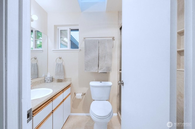 2113 186th Pl SE, Bothell, WA 98012 - bathroom featuring vanity, toilet, and a skylight