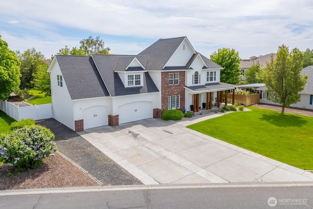 331 Viewmont Dr SE, Moses Lake, WA 98837 - view of front facade with brick siding, concrete driveway, covered porch, and roof with shingles