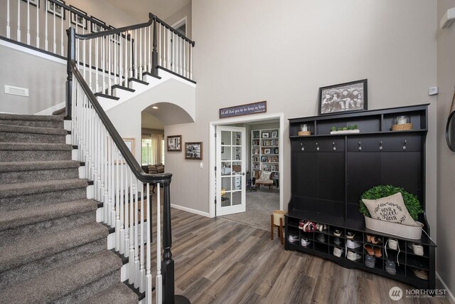 331 Viewmont Dr SE, Moses Lake, WA 98837 - mudroom featuring arched walkways, dark wood-style flooring, french doors, baseboards, and a high ceiling