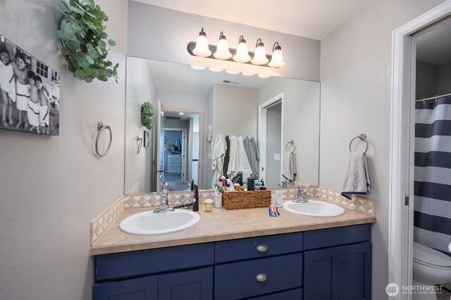 331 Viewmont Dr SE, Moses Lake, WA 98837 - bathroom featuring double vanity and toilet