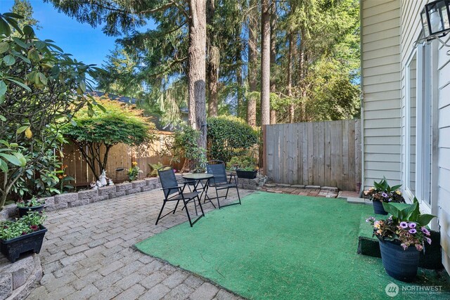 3120 Rustlewood Ln SE, Port Orchard, WA 98366 - fenced backyard featuring a patio area