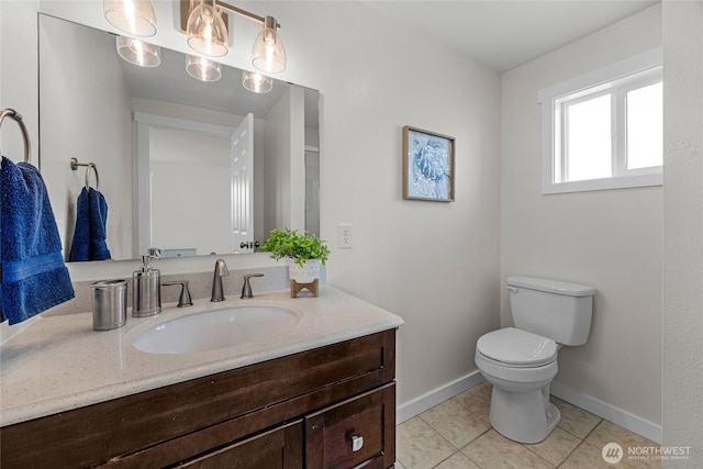 2409 Lombard Ave Unit C, Everett, WA 98201 - bathroom featuring vanity, baseboards, toilet, and tile patterned flooring