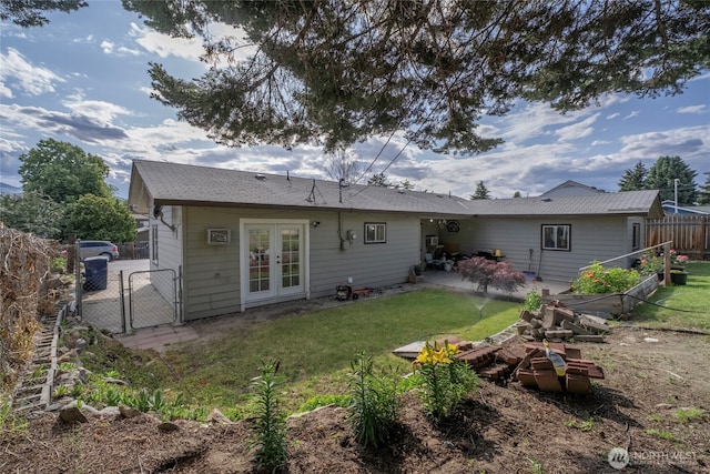 1011 N Dolfay Ln, East Wenatchee, WA 98802 - back of property with french doors, a gate, and a patio