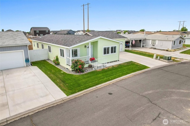 1701 E Burr Ave Unit 36, Moses Lake, WA 98837 - single story home with concrete driveway, covered porch, roof with shingles, a residential view, and stucco siding