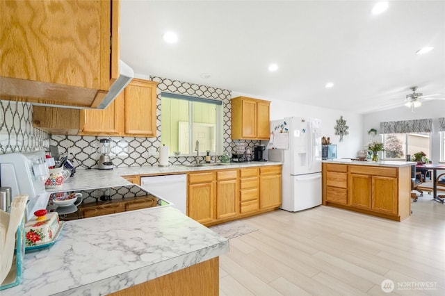 1701 E Burr Ave Unit 36, Moses Lake, WA 98837 - kitchen with white appliances, a peninsula, backsplash, light countertops, and recessed lighting