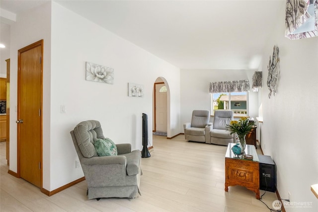 1701 E Burr Ave Unit 36, Moses Lake, WA 98837 - living area with arched walkways and light wood-style floors