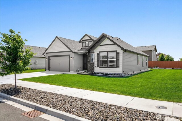 4737 W Owl St, Moses Lake, WA 98837 - view of front of home featuring an attached garage, concrete driveway, and roof with shingles