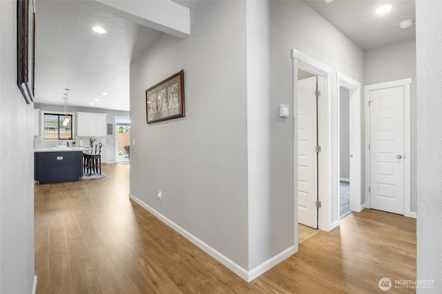 4737 W Owl St, Moses Lake, WA 98837 - hall featuring light wood finished floors, baseboards, and recessed lighting
