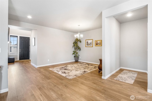 4737 W Owl St, Moses Lake, WA 98837 - empty room with a chandelier, light wood-type flooring, baseboards, and recessed lighting
