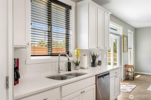 4737 W Owl St, Moses Lake, WA 98837 - kitchen with a sink, dishwasher, light countertops, and tasteful backsplash