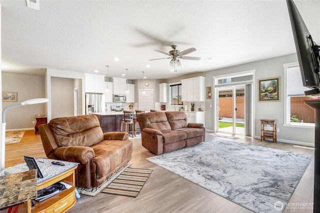 4737 W Owl St, Moses Lake, WA 98837 - living area with a ceiling fan, light wood-style floors, baseboards, and recessed lighting