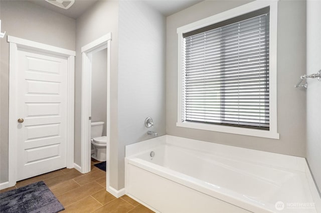 4737 W Owl St, Moses Lake, WA 98837 - full bathroom with a bath, toilet, and baseboards