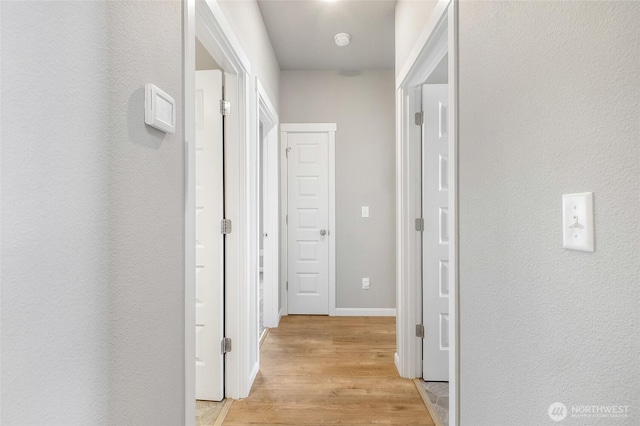 4737 W Owl St, Moses Lake, WA 98837 - hall featuring light wood-type flooring and baseboards