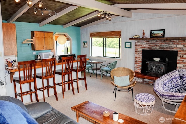 62 Wildwood Ln, Lopez Island, WA 98261 - living area with carpet flooring, wooden ceiling, and arched walkways