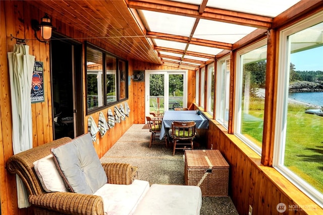 62 Wildwood Ln, Lopez Island, WA 98261 - sunroom / solarium with healthy amount of natural light, wooden walls, and a water view