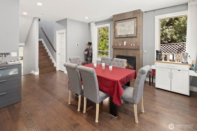 16422 76th Ave NE, Kenmore, WA 98028 - dining room featuring stairs, dark wood-style flooring, a large fireplace, recessed lighting, and baseboards
