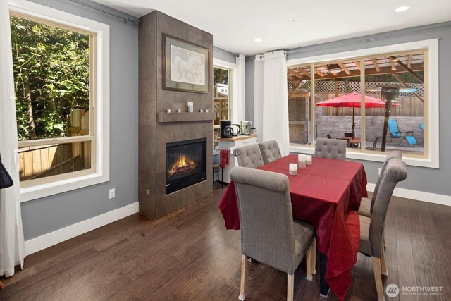 16422 76th Ave NE, Kenmore, WA 98028 - dining area with baseboards, wood finished floors, a tiled fireplace, and recessed lighting