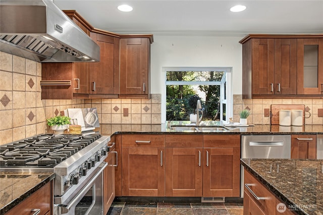 2942 222nd Pl SE, Sammamish, WA 98075 - kitchen with stainless steel range, exhaust hood, a sink, dark stone counters, and recessed lighting