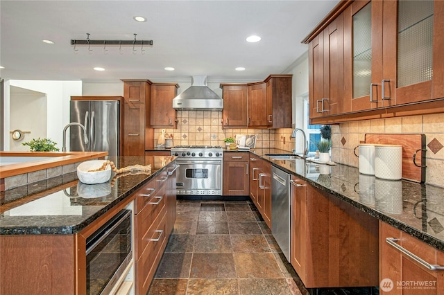 2942 222nd Pl SE, Sammamish, WA 98075 - kitchen with a sink, appliances with stainless steel finishes, wall chimney exhaust hood, tasteful backsplash, and dark stone counters