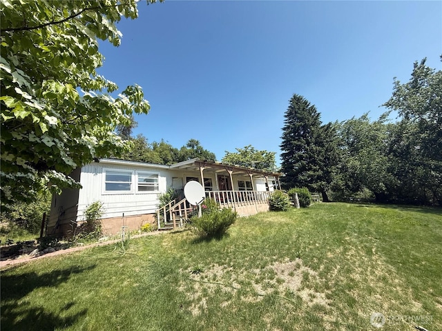 24 Hubbert Rd, Omak, WA 98841 - rear view of property with a lawn