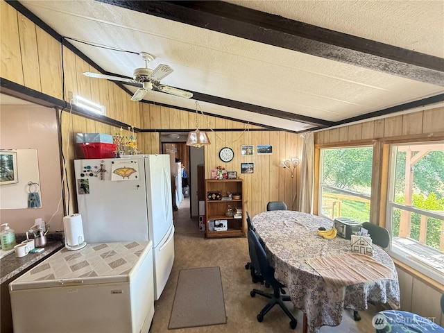 24 Hubbert Rd, Omak, WA 98841 - dining room featuring wooden walls, carpet flooring, and a ceiling fan