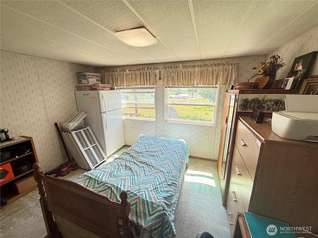 24 Hubbert Rd, Omak, WA 98841 - bedroom featuring freestanding refrigerator and wallpapered walls