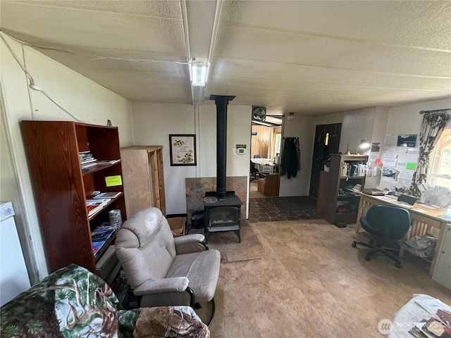 24 Hubbert Rd, Omak, WA 98841 - living area with a wood stove and a desk