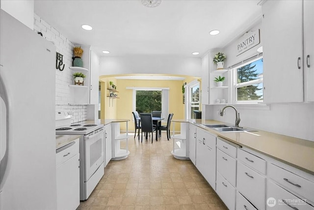 6712 A St, Tacoma, WA 98408 - kitchen featuring open shelves, white appliances, a sink, decorative backsplash, and recessed lighting