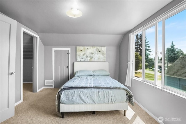 6712 A St, Tacoma, WA 98408 - carpeted bedroom with multiple windows, baseboards, and vaulted ceiling