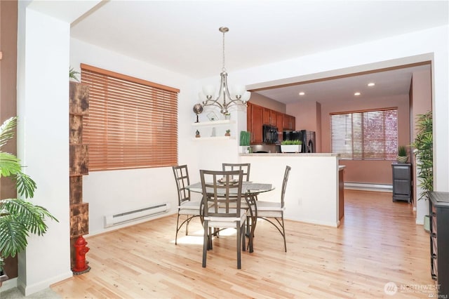 332 126th Pl SE Unit B, Everett, WA 98208 - dining area with a baseboard heating unit, light wood-style floors, a chandelier, and recessed lighting
