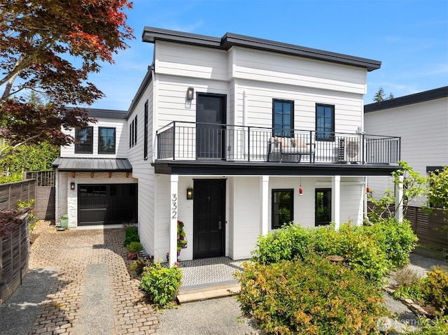 332 6th Ave, Kirkland, WA 98033 - view of front of house with a balcony, a standing seam roof, and a garage