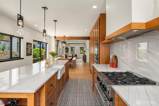 332 6th Ave, Kirkland, WA 98033 - kitchen featuring stainless steel gas stove, brown cabinetry, a sink, and recessed lighting
