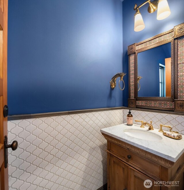 332 6th Ave, Kirkland, WA 98033 - bathroom featuring a wainscoted wall, vanity, and tile walls