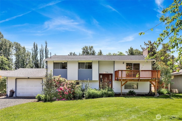 3125 Mcleod Rd, Bellingham, WA 98225 - view of front of home featuring a garage, a front yard, driveway, a chimney, and stucco siding