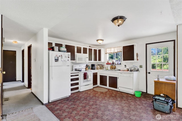 3125 Mcleod Rd, Bellingham, WA 98225 - kitchen featuring white appliances, light countertops, a textured ceiling, and white cabinets