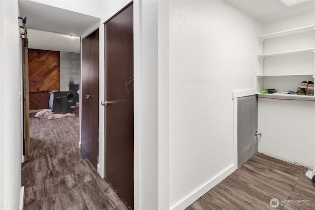 3125 Mcleod Rd, Bellingham, WA 98225 - hall featuring wood finished floors and a barn door