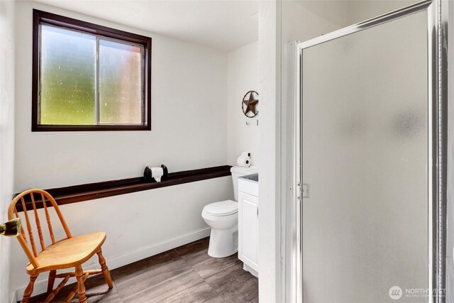 3125 Mcleod Rd, Bellingham, WA 98225 - bathroom featuring a stall shower, toilet, and baseboards