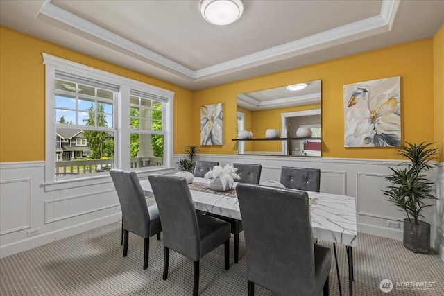 7320 111th Pl SE, Newcastle, WA 98056 - dining room with a raised ceiling, carpet floors, wainscoting, crown molding, and a decorative wall