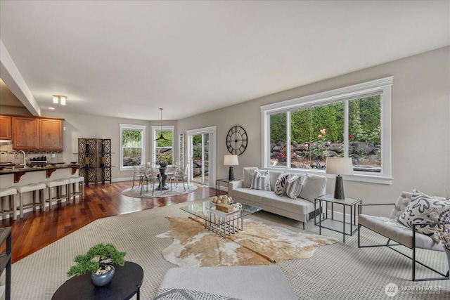 7320 111th Pl SE, Newcastle, WA 98056 - living room featuring dark wood-style floors and baseboards