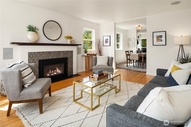 1210 S Mcclellan St, Seattle, WA 98144 - living area featuring light wood-type flooring and a tile fireplace