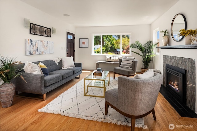 1210 S Mcclellan St, Seattle, WA 98144 - living area featuring a tile fireplace and wood finished floors