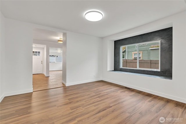 4117 S M St, Tacoma, WA 98418 - unfurnished room featuring baseboards and wood finished floors