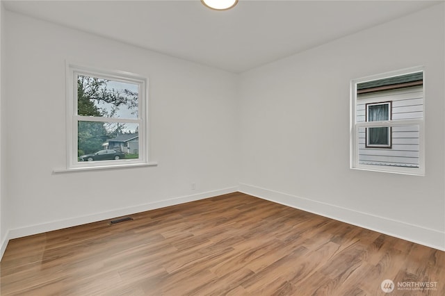 4117 S M St, Tacoma, WA 98418 - spare room with baseboards and wood finished floors