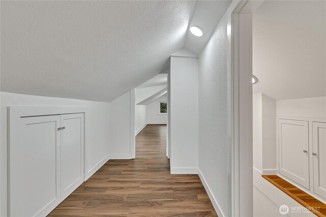 4117 S M St, Tacoma, WA 98418 - bonus room featuring lofted ceiling, wood finished floors, a textured ceiling, and baseboards